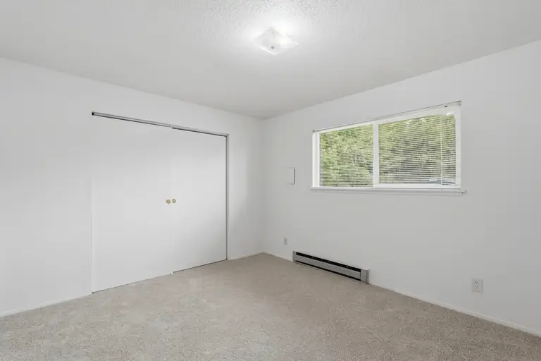 Bedroom with a wide closet and window