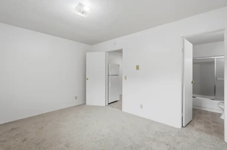 Bedroom with a doorway to the bathroom